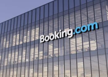 Amsterdam, Netherlands. November 3D CGI. Booking Holding Signage Logo Top Glass Building. Workplace Online Marketplace Homestay Rental Service Company in Office Building.